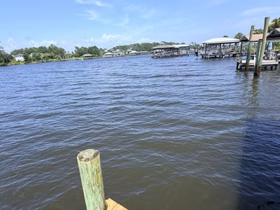 Enjoy stunning water views from this prime waterfront property, with direct access to boating and fishing.