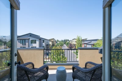 Double French doors open to this private deck that overlooks the surrounding neighborhood and takes in the the gorgeous Oregon sunsets.