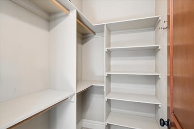 Two of two walk-in closets in the primary suite.