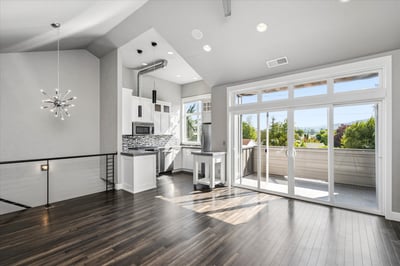 Wall of windows and large sliding glass door to the deck.