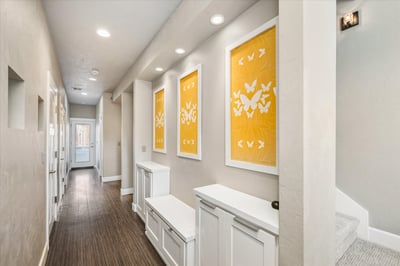 Main level entry hall with built-in shelving.