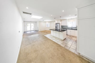 View towards kitchen, family area, primary suite and backyard