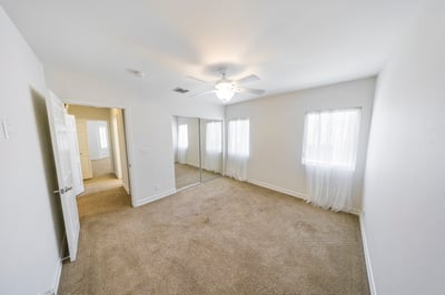 View towards front bedroom, laundry closet and bathroom