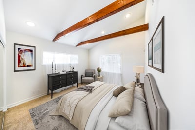 Virtually staged primary bedroom suite