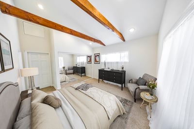 Virtually staged primary bedroom suite