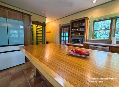 Island countertop is repurposed bowling lane.