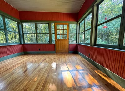 Kitchen opens to 3-Season Sunroom. NEW Insulated Hardwood Floor. Hand-built Door.