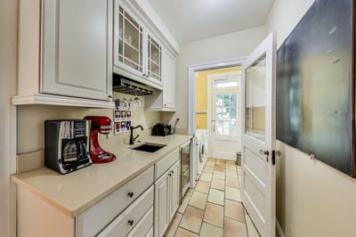 Main level butler's pantry with beverage fridge