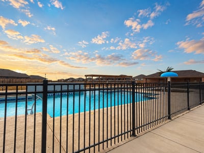 Bright and inviting community pool area, perfect for relaxation and entertainment under expansive skies.