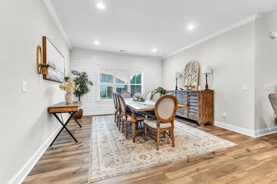 Bright dining area featuring an inviting blend of modern design and cozy warmth, perfect for gatherings.