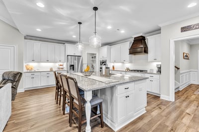 Modern kitchen featuring ample counter space, a spacious island, and high-end appliances, perfect for entertaining.