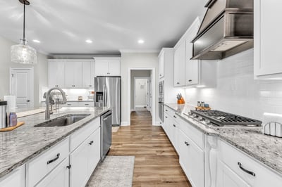 Modern kitchen featuring sleek appliances, ample counter space, and a welcoming layout perfect for entertaining.