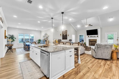 Bright and spacious open-concept living area features modern amenities and natural light throughout.