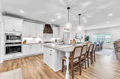 Bright and inviting kitchen featuring modern appliances, ample counter space, and a spacious dining area.