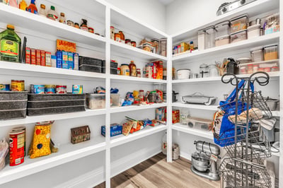 Spacious pantry with organized shelving, perfect for maximizing storage and easily accessing your essentials.