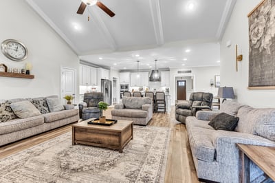 Spacious living area with vaulted ceilings, offering ample room for relaxation and entertaining.