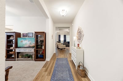 Welcome to this inviting entryway featuring natural light and a seamless flow into the living space.