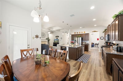 Bright and inviting kitchen and dining area featuring modern appliances and ample space for gatherings.