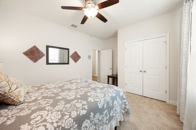 Cozy bedroom featuring modern fixtures, ample natural light, and convenient access to nearby amenities.