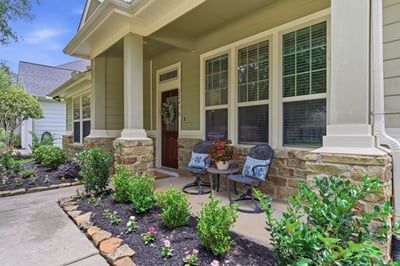 Lovely front porch to enjoy your morning coffee and wave to neighbors.