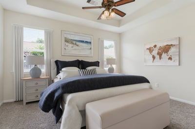 Fantastic primary bedroom with tray ceilings. Virtually staged.