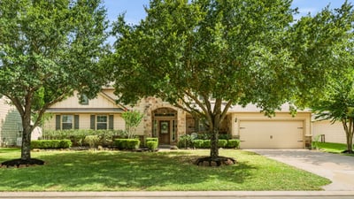 This well-maintained home features lush landscaping and spacious outdoor areas, ideal for family living and entertaining.