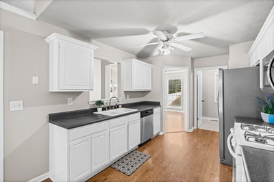 Modern kitchen featuring sleek countertops, ample cabinetry, and a bright, open layout perfect for cooking and entertaining.