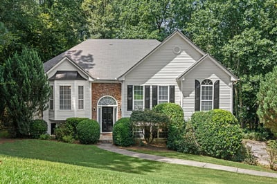 Discover this inviting home, featuring a unique blend of modern design and lush landscaping in a tranquil setting.