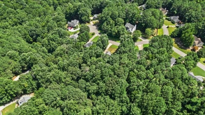 Expansive wooded setting with winding streets and convenient access to nearby residential amenities and local attractions.