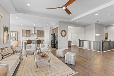 Spacious open-concept living area with modern finishes and abundant natural light, perfect for entertaining.