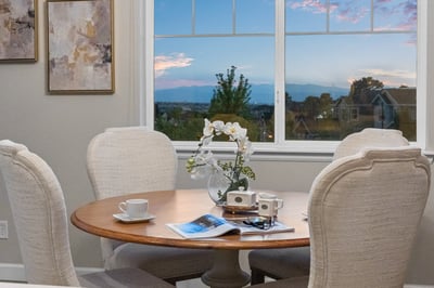 Bright dining area featuring a scenic view, perfect for morning coffee and cozy gatherings.