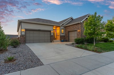 Beautifully designed home featuring a welcoming entrance and well-maintained landscaping in a peaceful neighborhood.