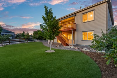 This inviting home features ample outdoor space and a welcoming deck, perfect for gatherings and relaxation.