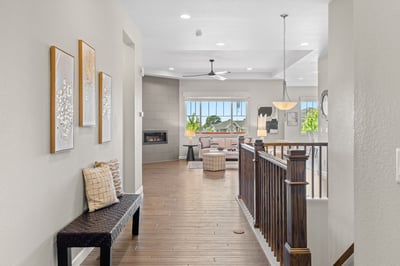 Spacious entryway leads to a bright living area, featuring modern finishes and large windows showcasing stunning views.