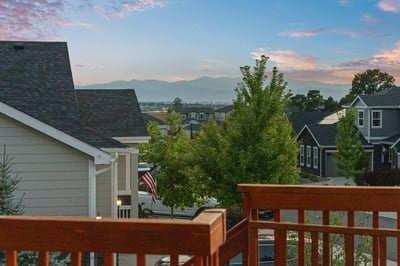 Enjoy stunning mountain views and a vibrant neighborhood from this inviting outdoor space.