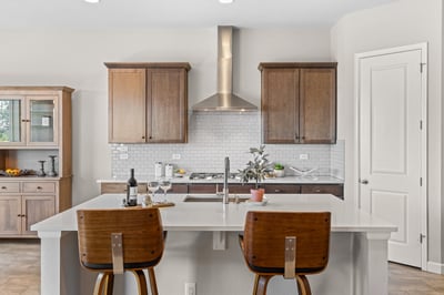 Modern kitchen featuring sleek cabinetry, spacious island seating, and contemporary appliances for effortless entertaining.