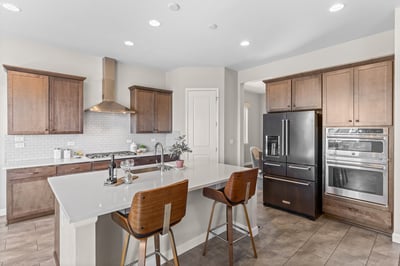 Modern kitchen featuring sleek cabinetry, high-end appliances, and a spacious island ideal for entertaining.