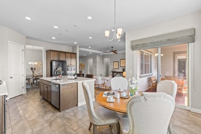 Bright, open kitchen and dining area with modern appliances, perfect for entertaining and everyday living.