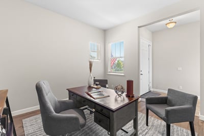 Bright and airy office space featuring large windows and ample room for productivity and organization.