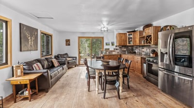 Spacious open-concept kitchen and living area featuring modern appliances and abundant natural light.