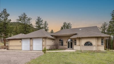 Modern home with generous space, large garage, and picturesque mountain views, perfect for outdoor enthusiasts.