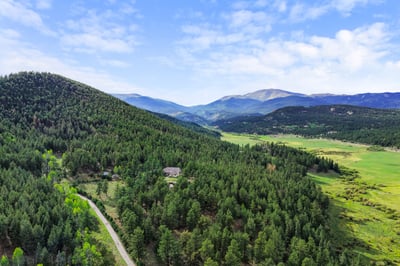 Expansive mountain views and lush greenery create a stunning backdrop for your dream home retreat.