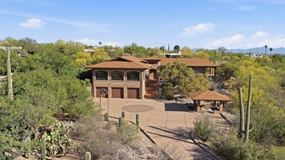 Nestled in desert greenery, this spacious home offers panoramic views and ample outdoor space for gatherings.