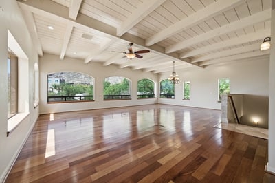 Spacious open-plan living area with abundant natural light and views, perfect for entertaining or relaxing.