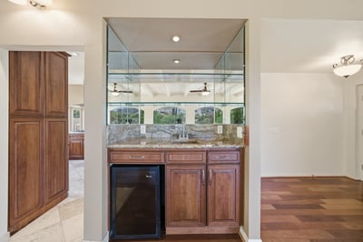 Spacious wet bar area ideal for entertaining, featuring modern finishes and seamless flow to living spaces.