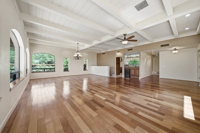 Spacious open floor plan featuring abundant natural light and beautiful hardwood floors throughout.
