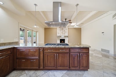 Spacious kitchen with modern appliances, a center island, and an inviting outdoor view for entertaining.