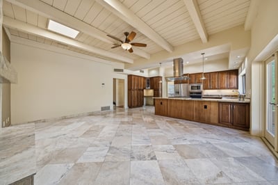 Spacious open-concept kitchen and living area featuring natural light, modern appliances, and ample cabinetry.