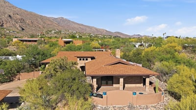 Discover this spacious hillside home surrounded by natural beauty and stunning mountain views, perfect for relaxation.