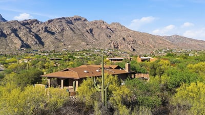 Nestled in a vibrant desert landscape, this home offers stunning mountain views and abundant natural beauty.
